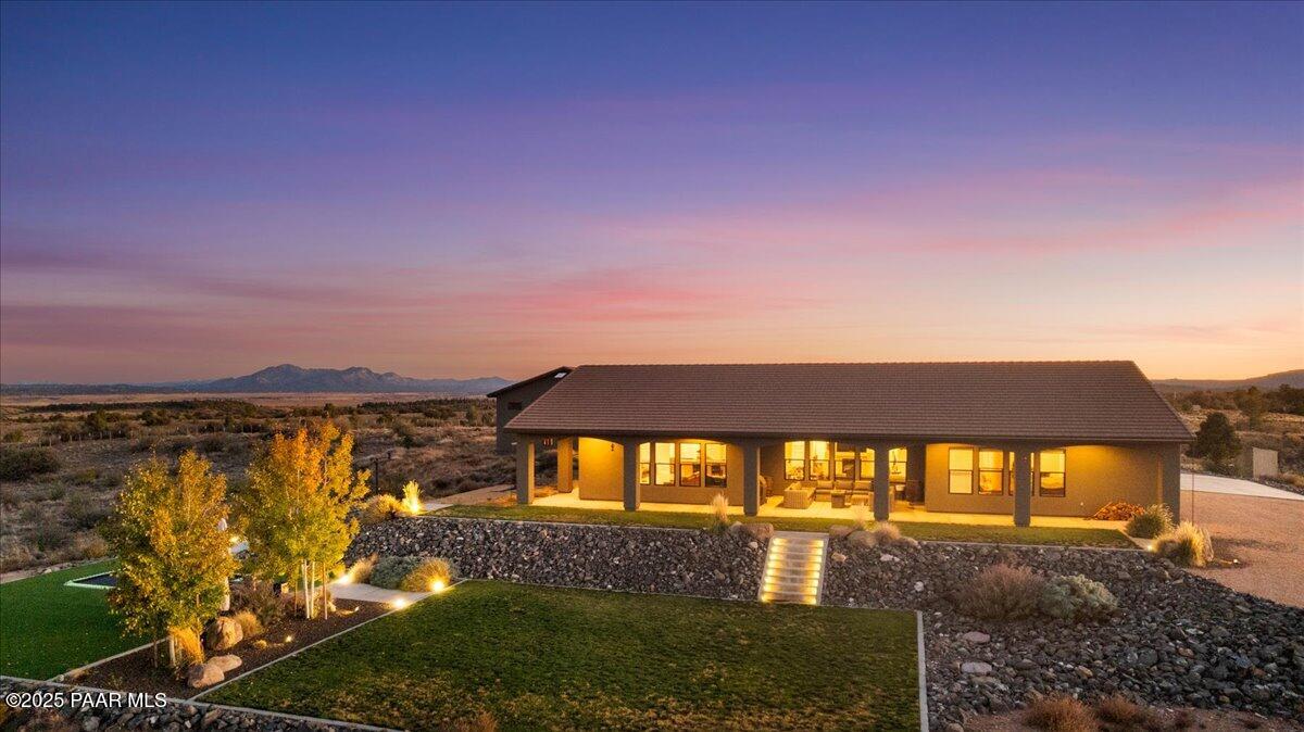 12300 West Slate Road Prescott, AZ 86305 - Photo 32 of 59 a view of a house with a yard and balcony