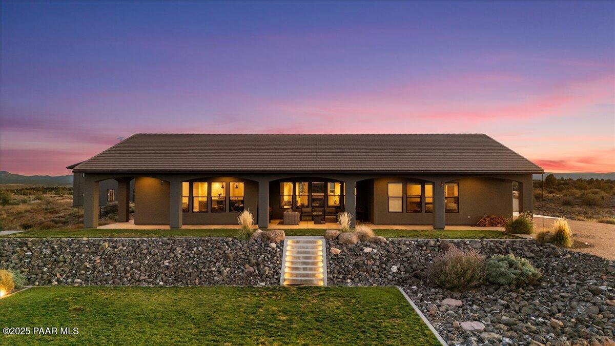 12300 West Slate Road Prescott, AZ 86305 - Photo 33 of 59 a front view of a house with garden