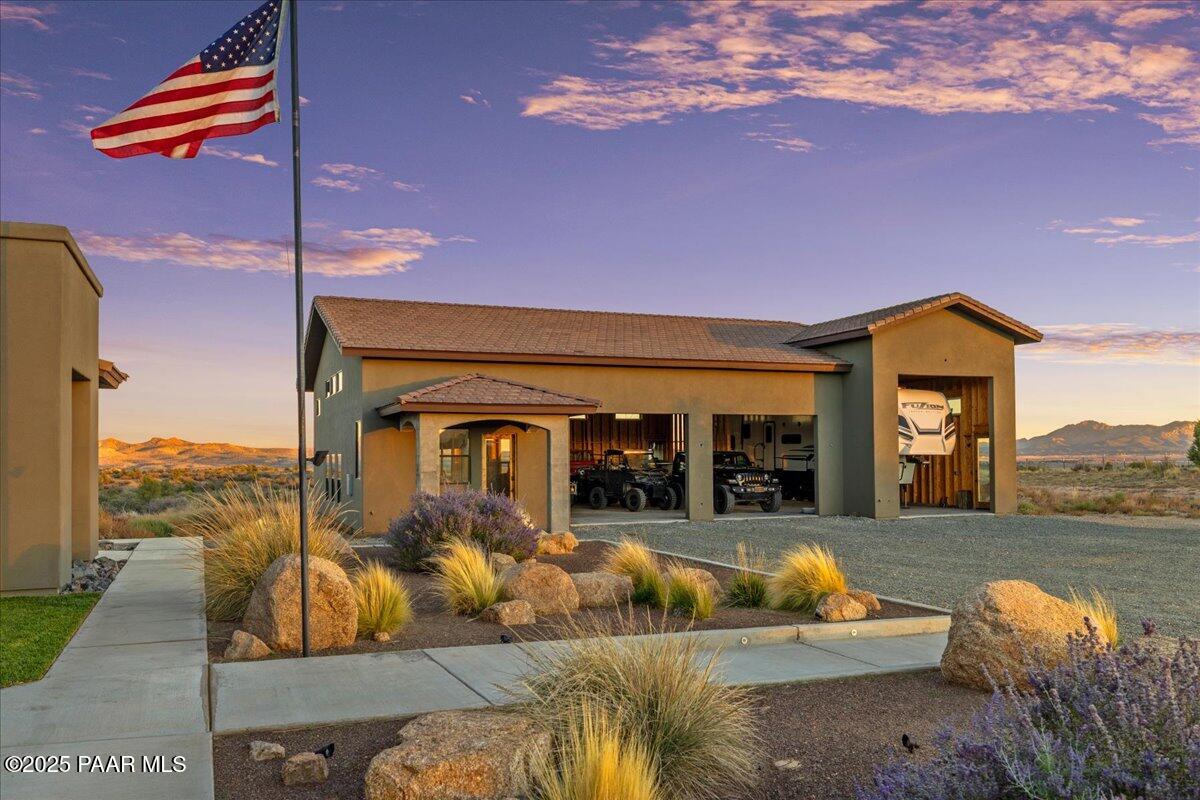 12300 West Slate Road Prescott, AZ 86305 - Photo 49 of 59 a view of a house with a couches in a patio