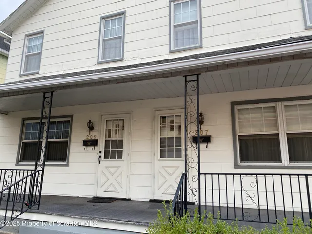 a front view of a house with a porch