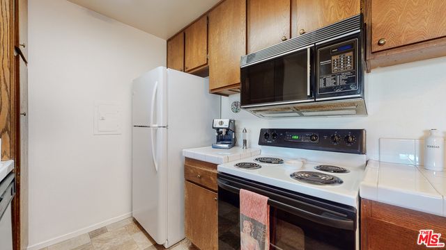 a kitchen with a stove and a microwave