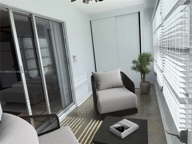 a living room with furniture and a window