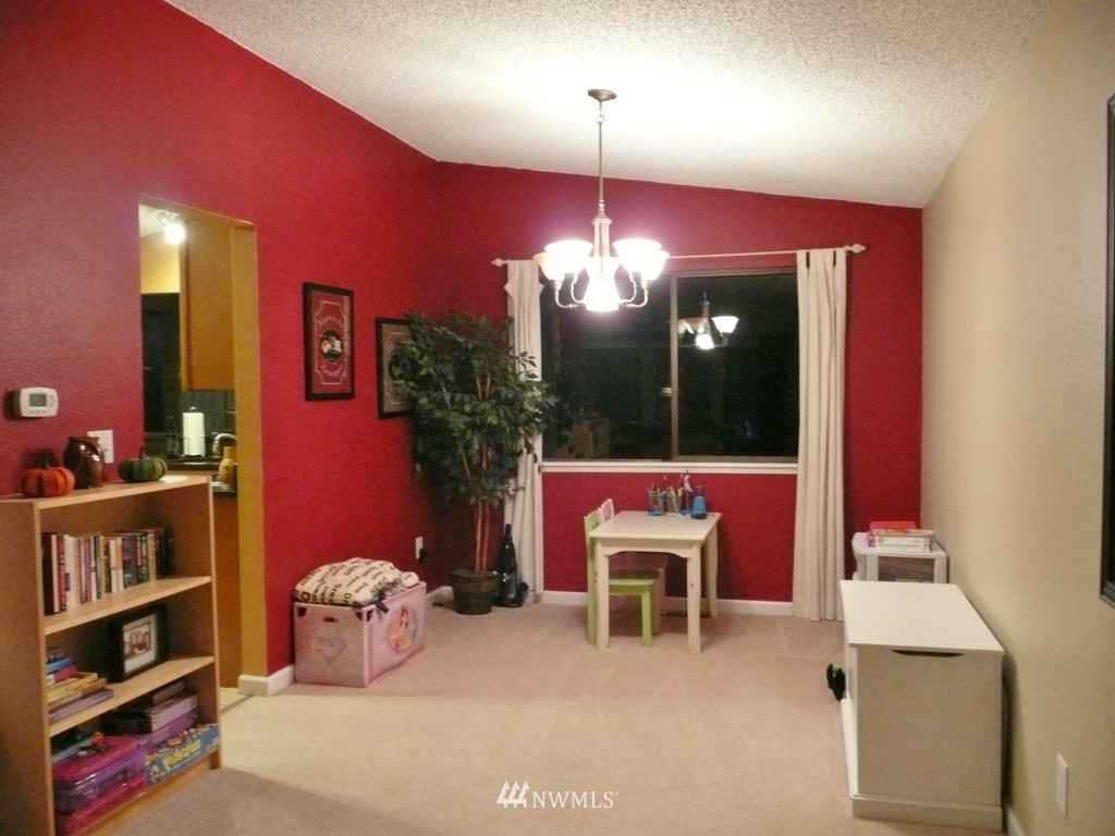 2131 240th Place Southeast Bothell, WA 98021 - Photo 8 of 20 a dining room with furniture and chandelier fan