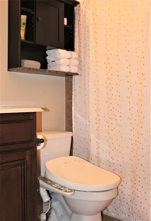 a bathroom with a toilet and a sink