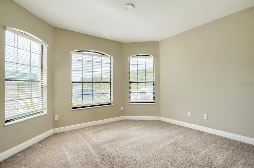 12690 Vander Way New Port Richey, FL 34654 - Photo 8 of 22 a view of an empty room with a window