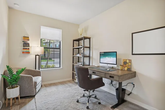 a workspace with furniture and window