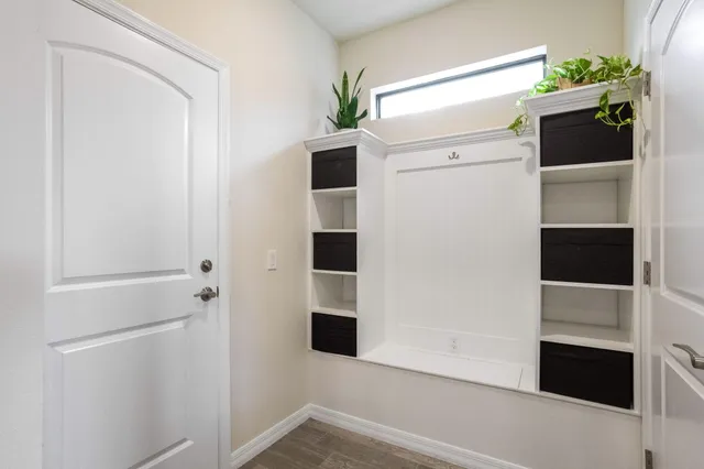 a bathroom with a shower and a mirror