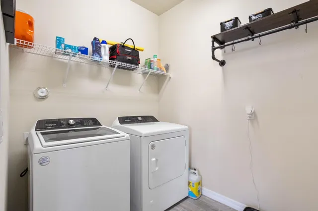a utility room with dryer and washer