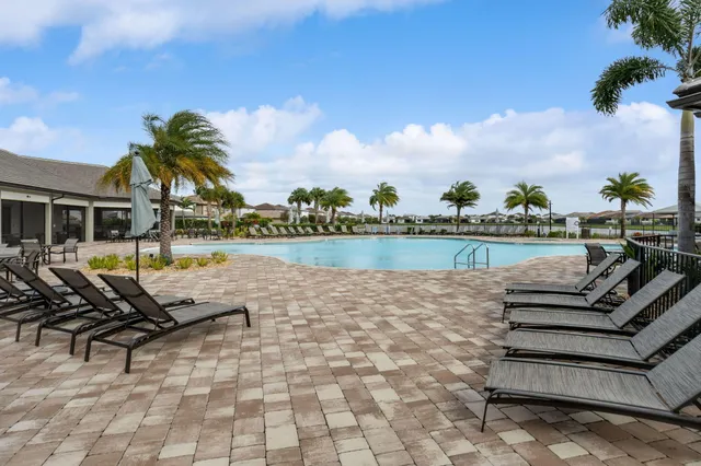 a view of a lake with couches and city view