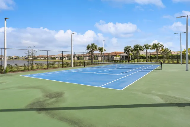 a view of an outdoor space and tennis court