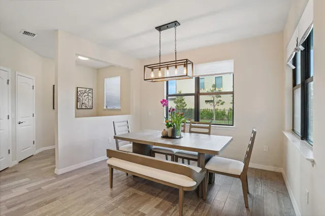 a dining room with furniture window wooden floor
