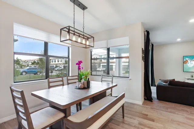 a view of a dining room with furniture window and outside view