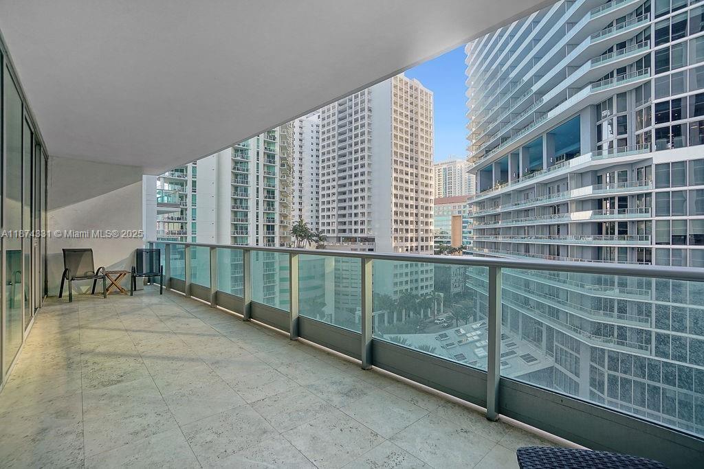 1331 Brickell Bay Drive, Unit 906 Miami, FL 33131 - Photo 11 of 13 a view of a balcony with a ceiling fan