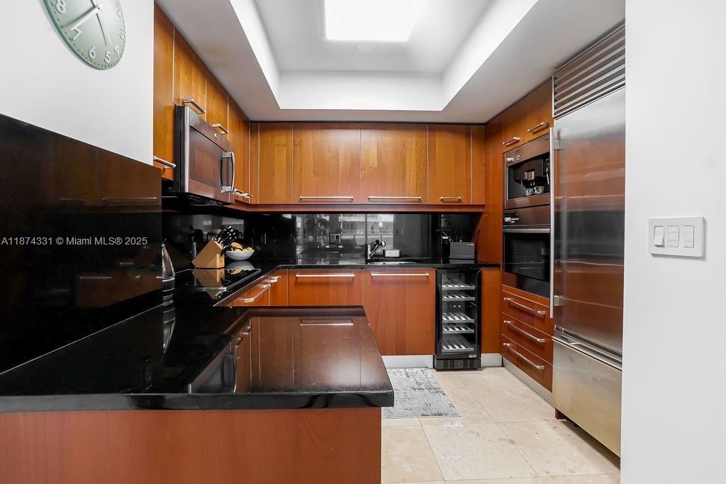 1331 Brickell Bay Drive, Unit 906 Miami, FL 33131 - Photo 4 of 13 a kitchen with an oven and cabinets