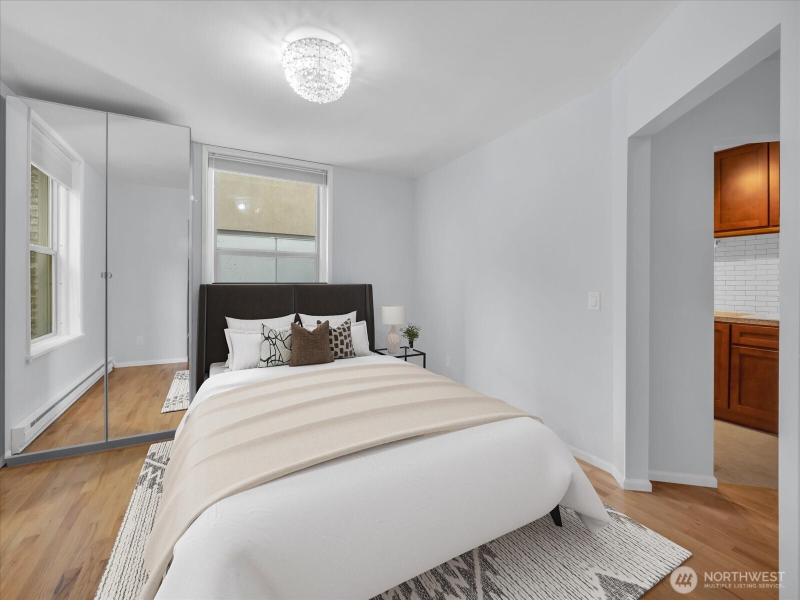 7 Harrison Street, Unit 17 Seattle, WA 98109 - Photo 7 of 20 a bedroom with a bed and a tv