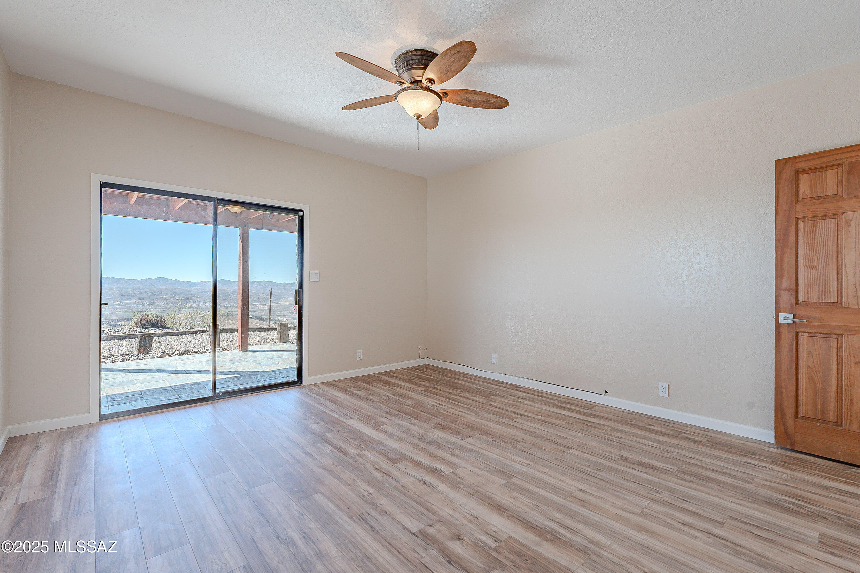 467 Camino Osito Rio Rico, AZ 85648 - Photo 37 of 50 wooden floor in an empty room with a window