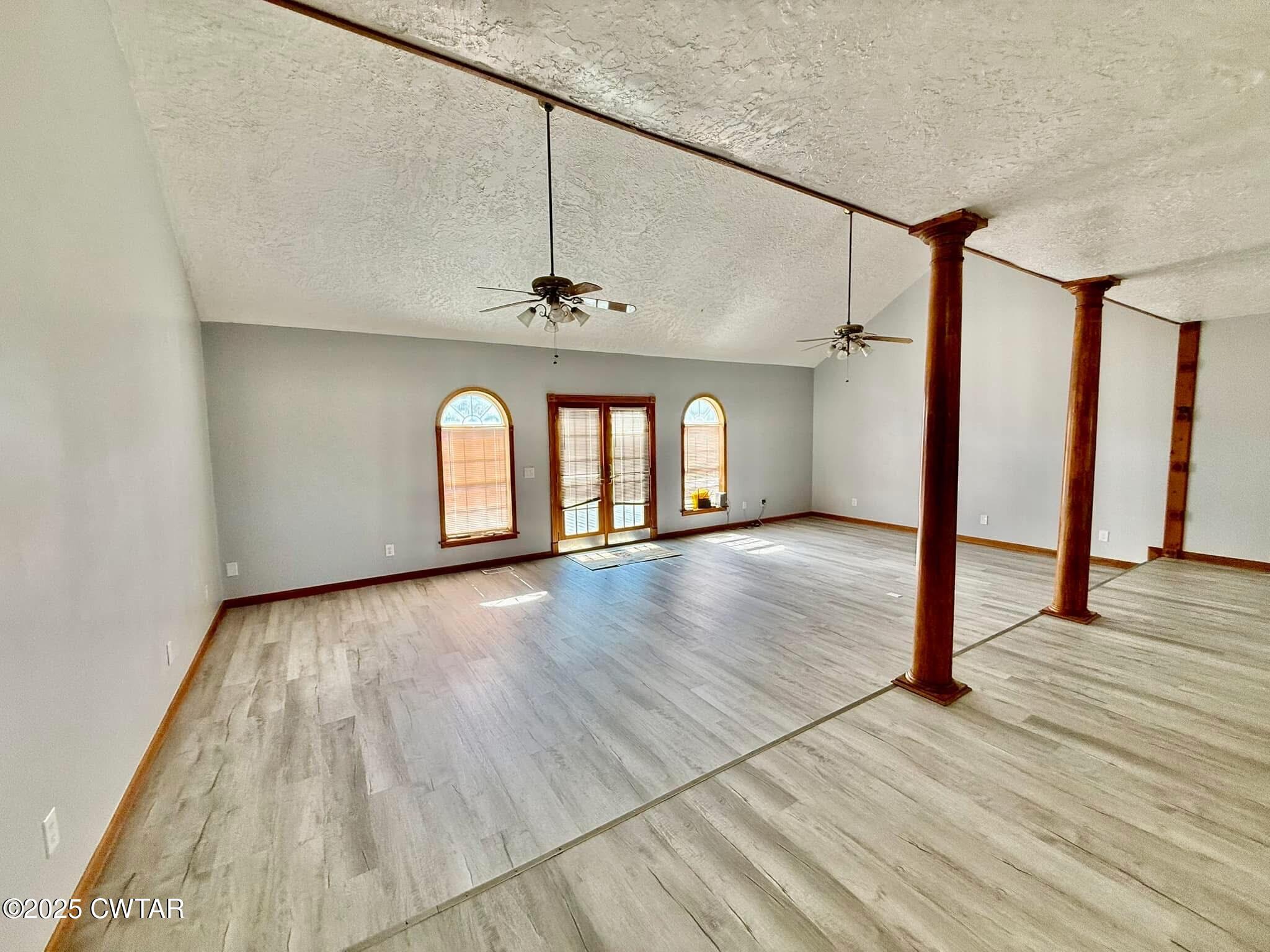 1559 Ella Groom Road Troy, TN 38260 - Photo 11 of 23 a view of an empty room with wooden floor and a window