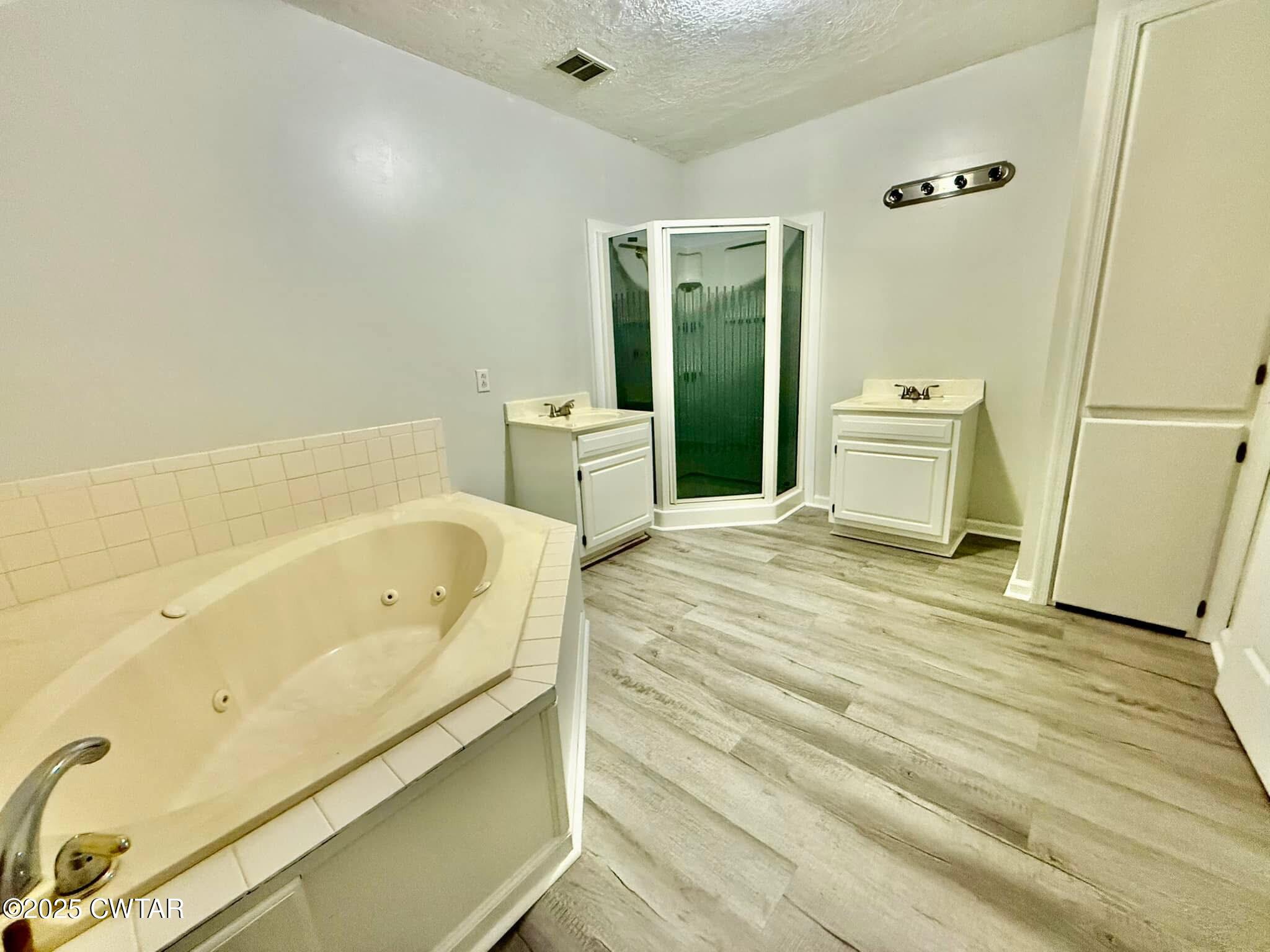 1559 Ella Groom Road Troy, TN 38260 - Photo 23 of 23 a bathroom with a bathtub and a sink