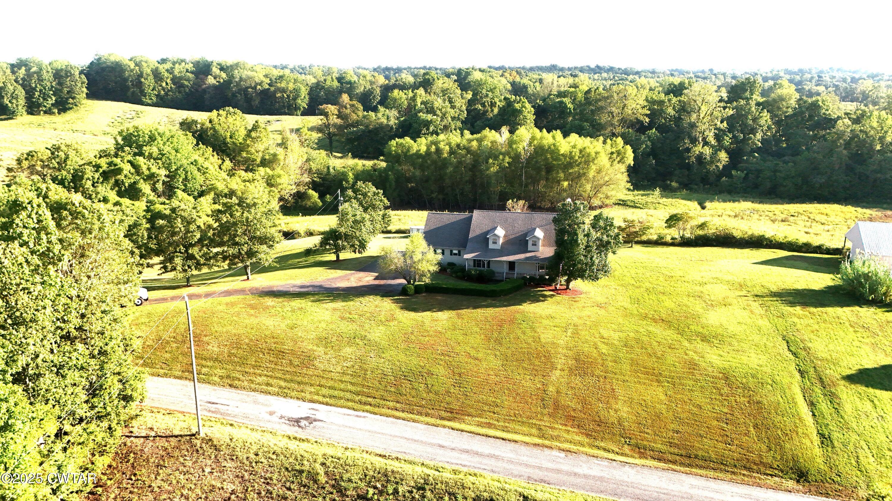 1559 Ella Groom Road Troy, TN 38260 - Photo 3 of 23 a view of a swimming pool with an ocean view