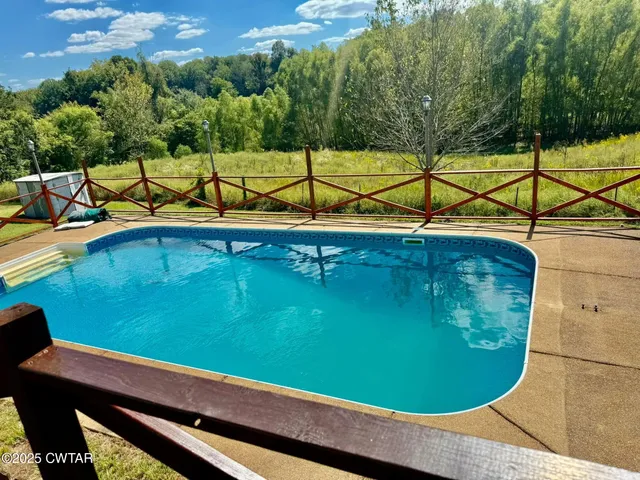 a view of a swimming pool with a balcony