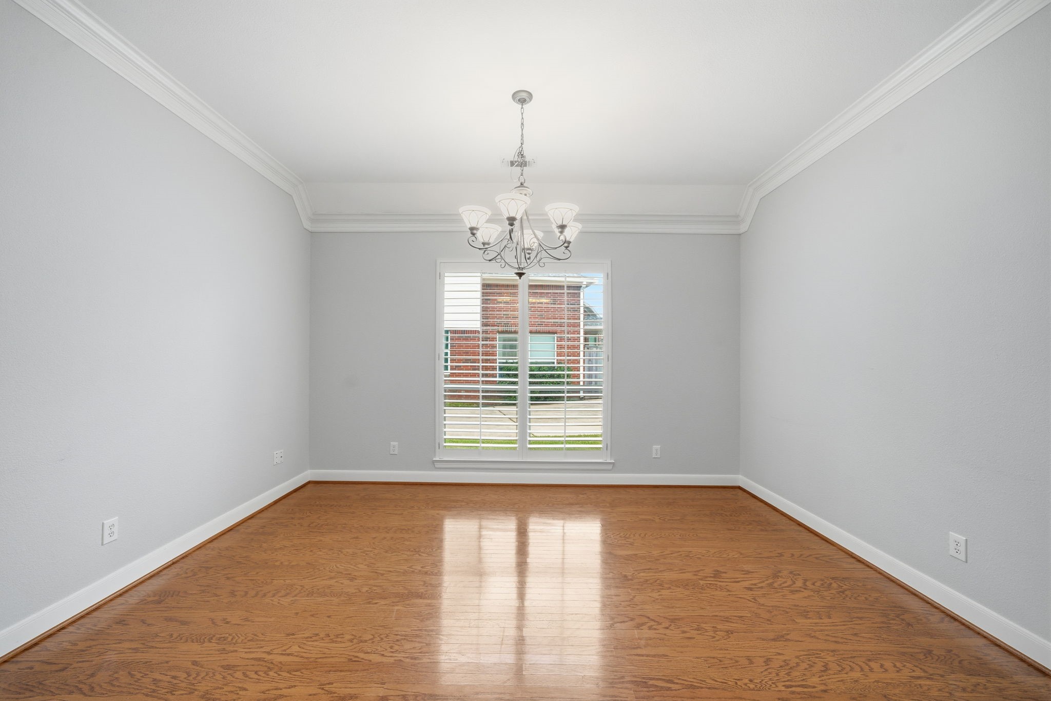 2842 Nicks Run Lane Katy, TX 77494 - Photo 14 of 35 an empty room with wooden floor and windows