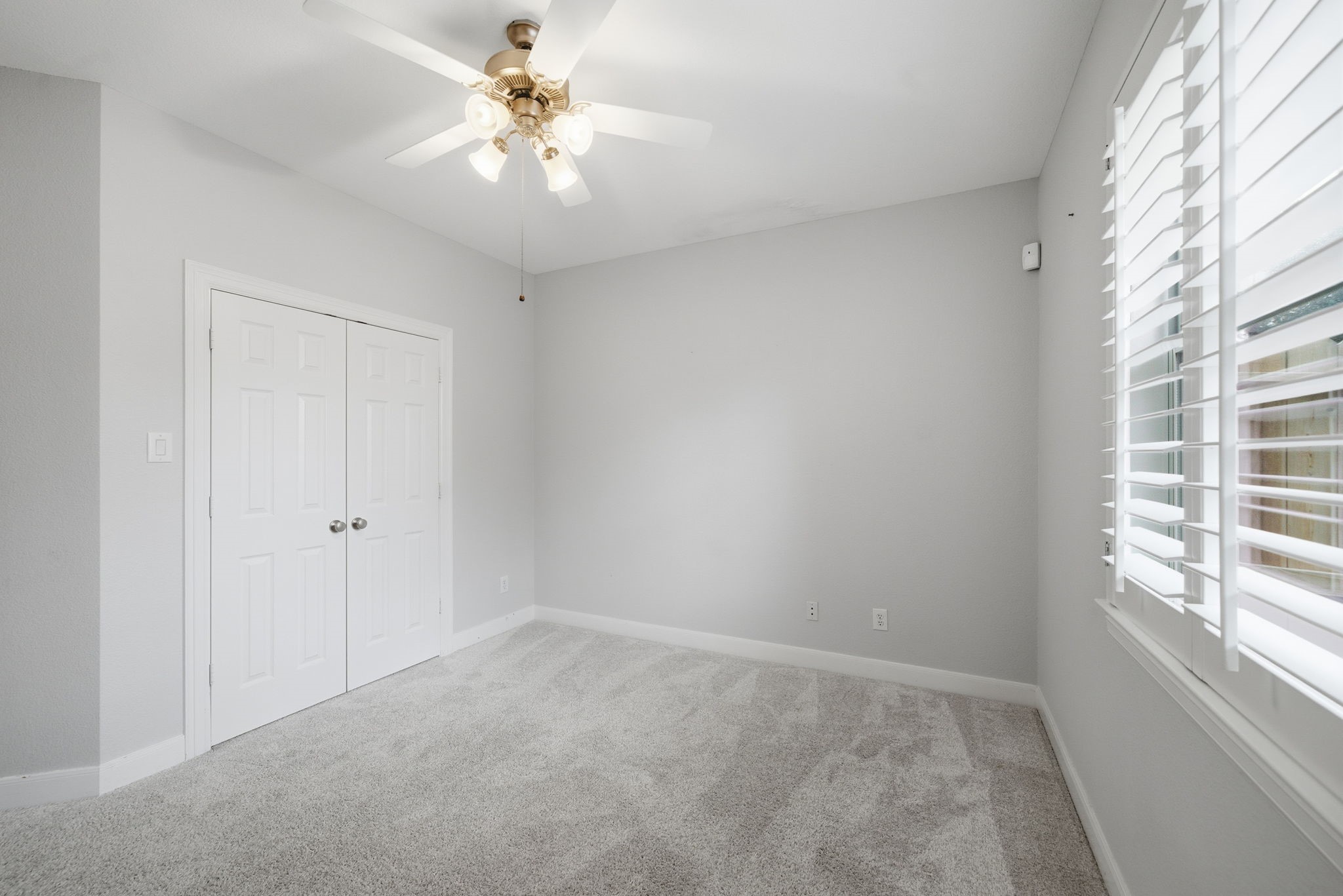 2842 Nicks Run Lane Katy, TX 77494 - Photo 20 of 35 wooden floor in an empty room with a window