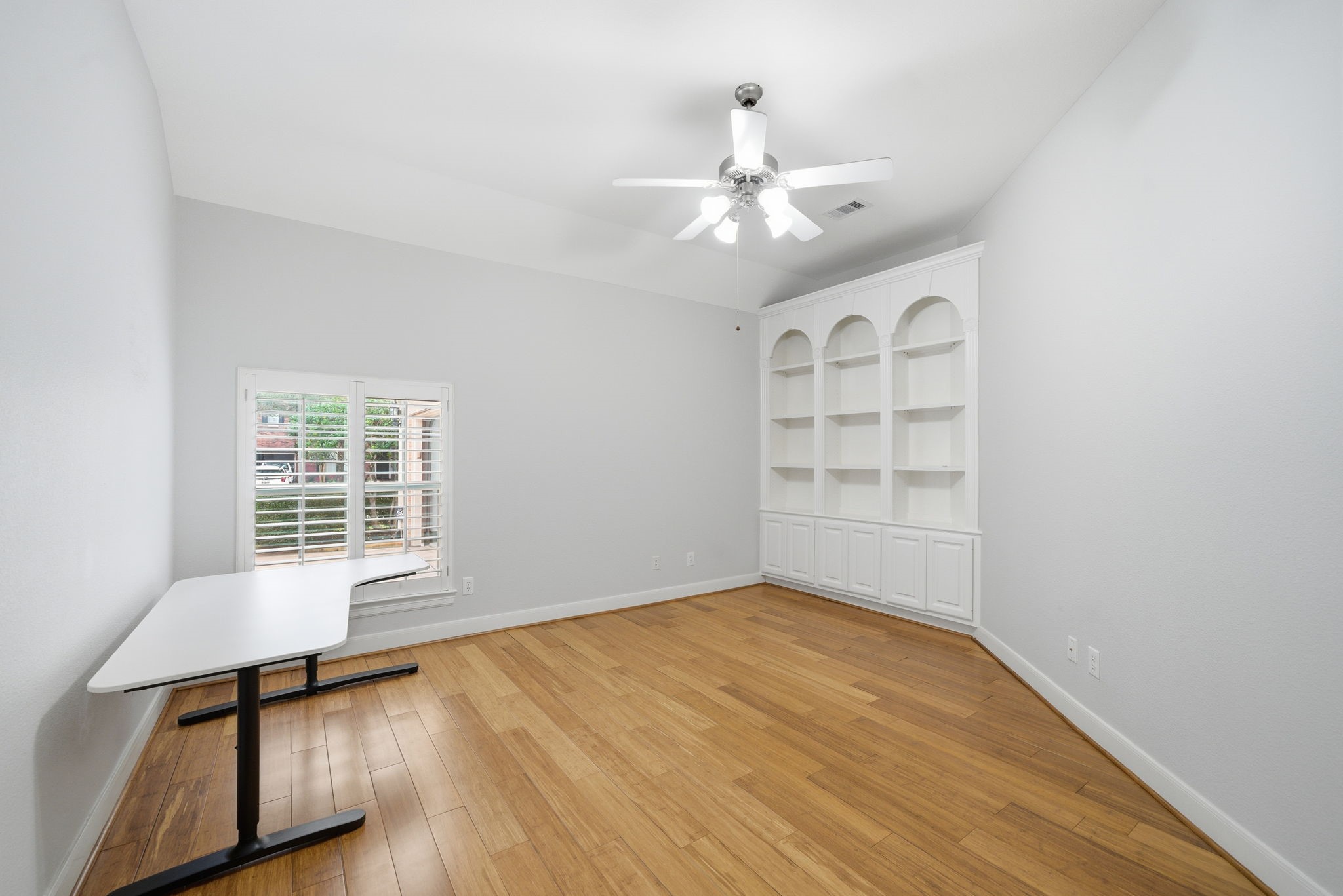 2842 Nicks Run Lane Katy, TX 77494 - Photo 24 of 35 a view of an empty room with a window and wooden floor