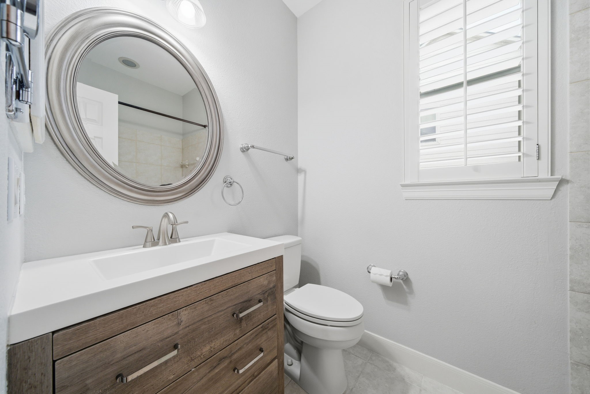 2842 Nicks Run Lane Katy, TX 77494 - Photo 26 of 35 a bathroom with a toilet a sink and a mirror