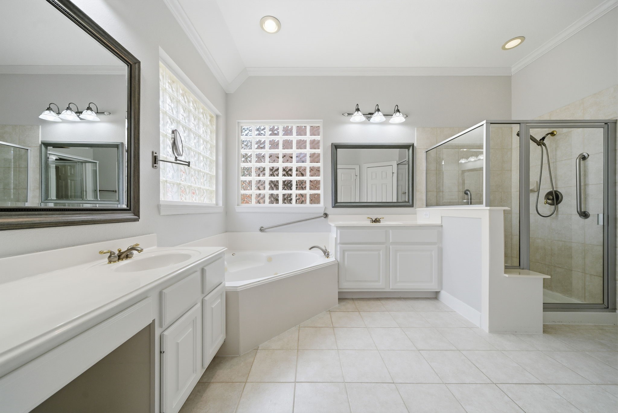 2842 Nicks Run Lane Katy, TX 77494 - Photo 28 of 35 a spacious bathroom with a double vanity sink a mirror a bathtub and a shower