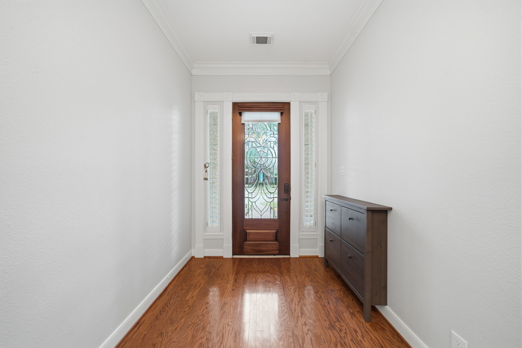 2842 Nicks Run Lane Katy, TX 77494 - Photo 4 of 35 a view of an empty room with window and wooden floor