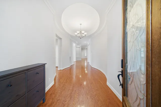 a very nice looking hallway with a mirror