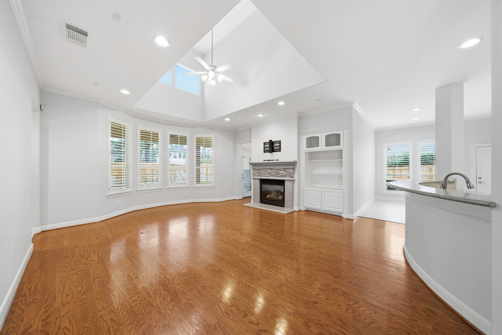2842 Nicks Run Lane Katy, TX 77494 - Photo 6 of 35 a view of an empty room with window and wooden floor