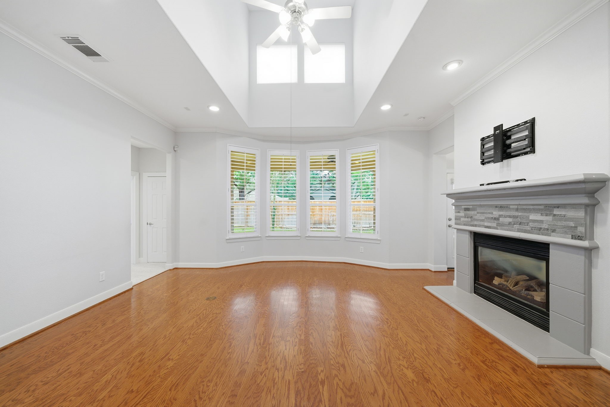 2842 Nicks Run Lane Katy, TX 77494 - Photo 7 of 35 a view of an empty room with window and fire place
