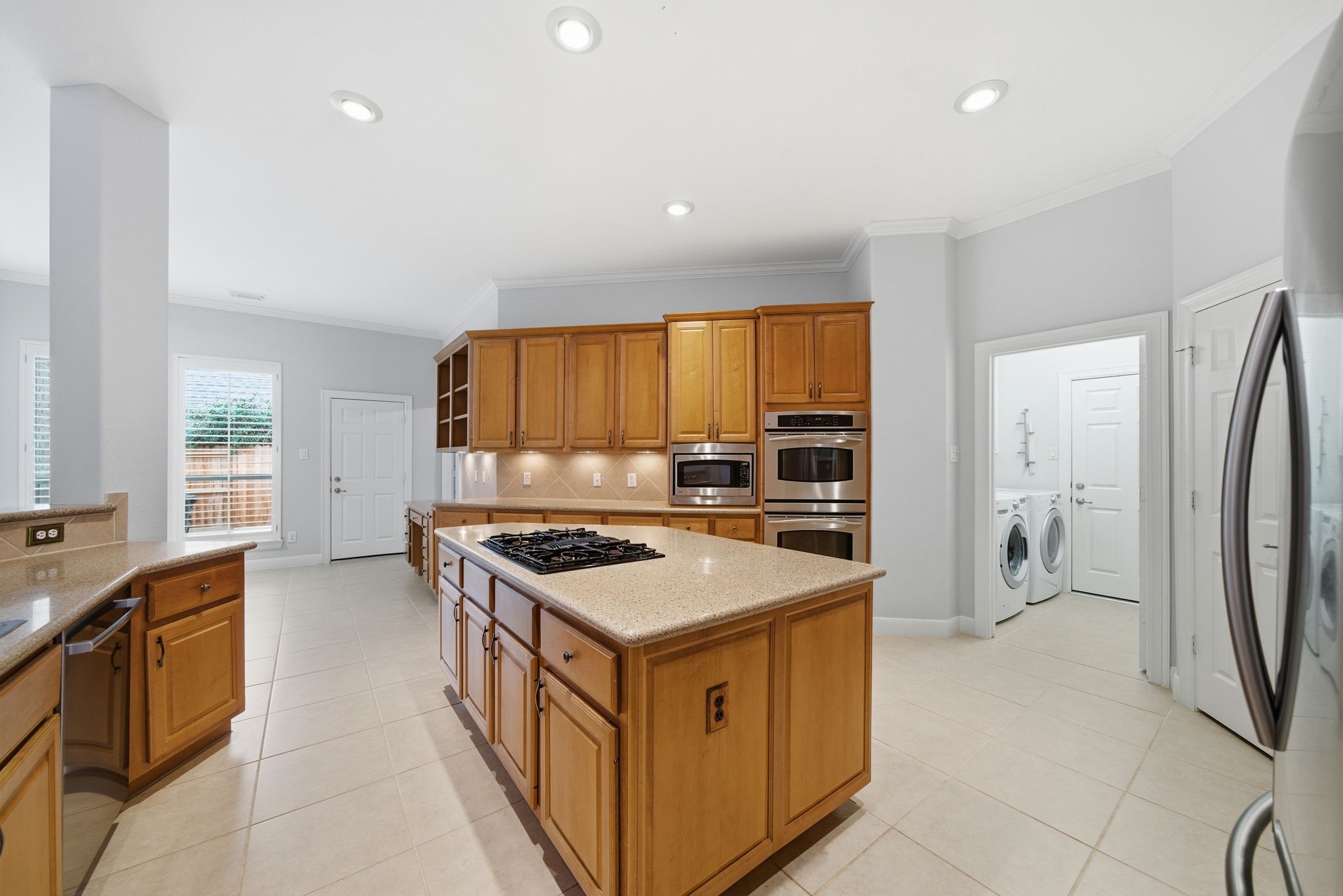 2842 Nicks Run Lane Katy, TX 77494 - Photo 10 of 35 a kitchen with a stove a refrigerator and a sink
