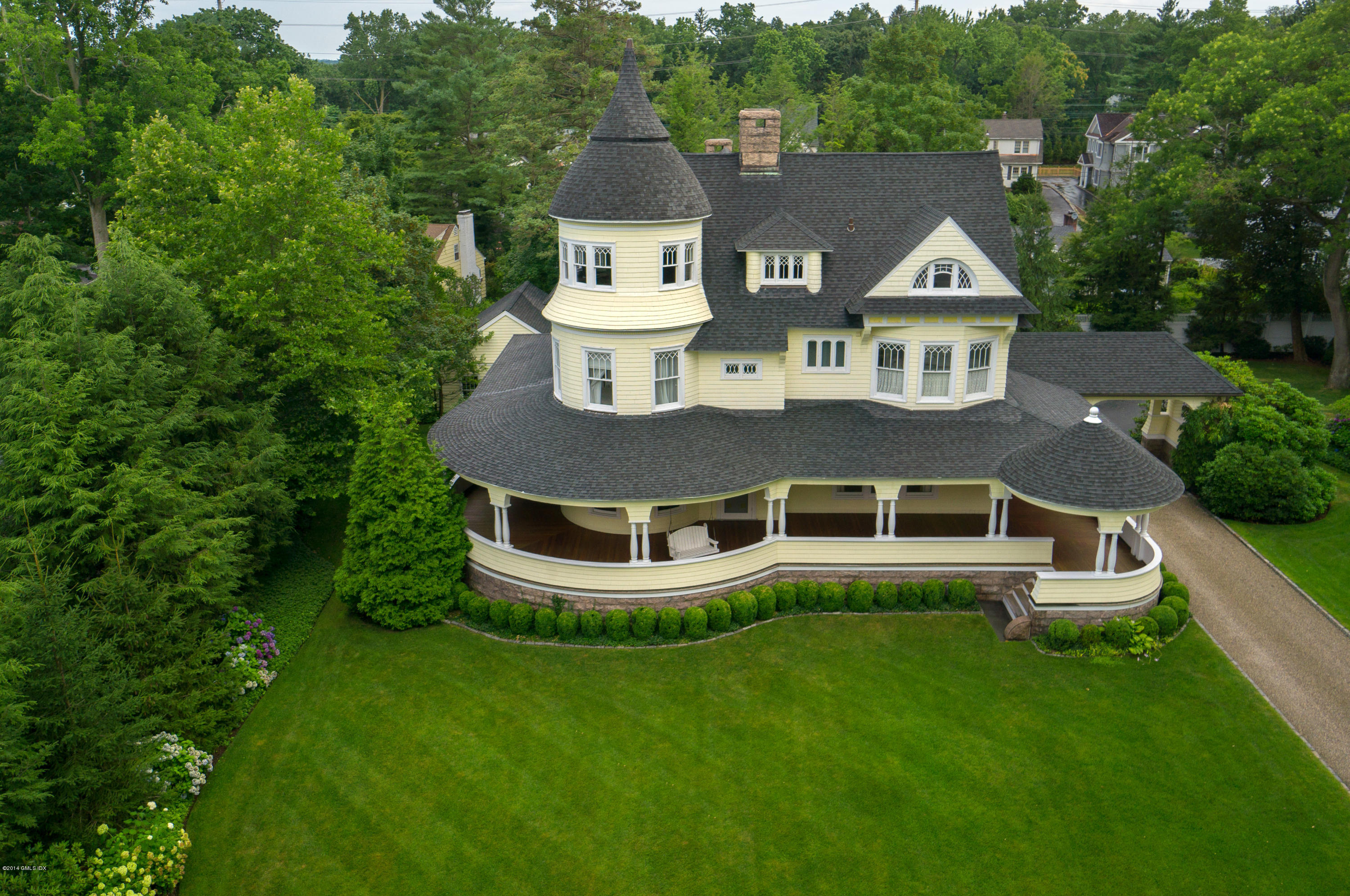 11 Club Road Riverside, CT 06878 - Photo 3 of 16 a aerial view of a house with a yard table and chairs