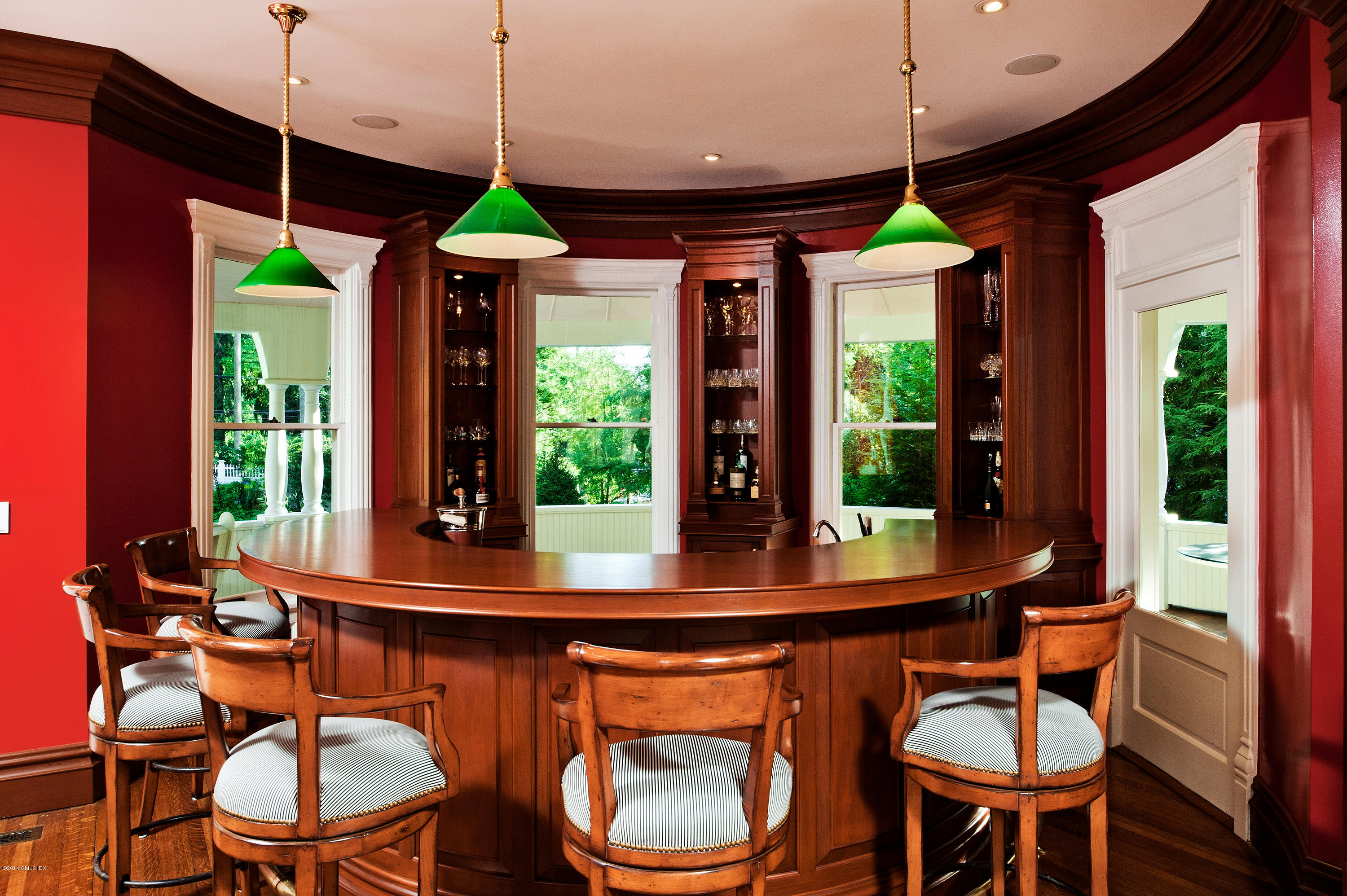 11 Club Road Riverside, CT 06878 - Photo 9 of 16 a dining room with wooden floor a chandelier a glass table and chairs