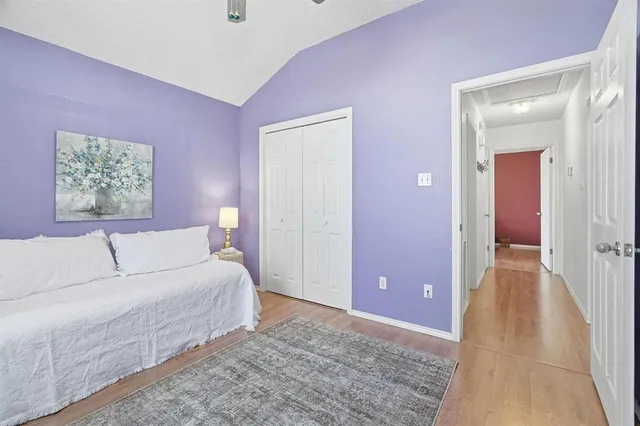 a spacious bedroom with a bed and a couch