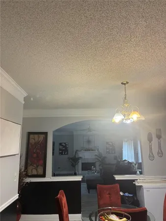 a living room with furniture and a lamp