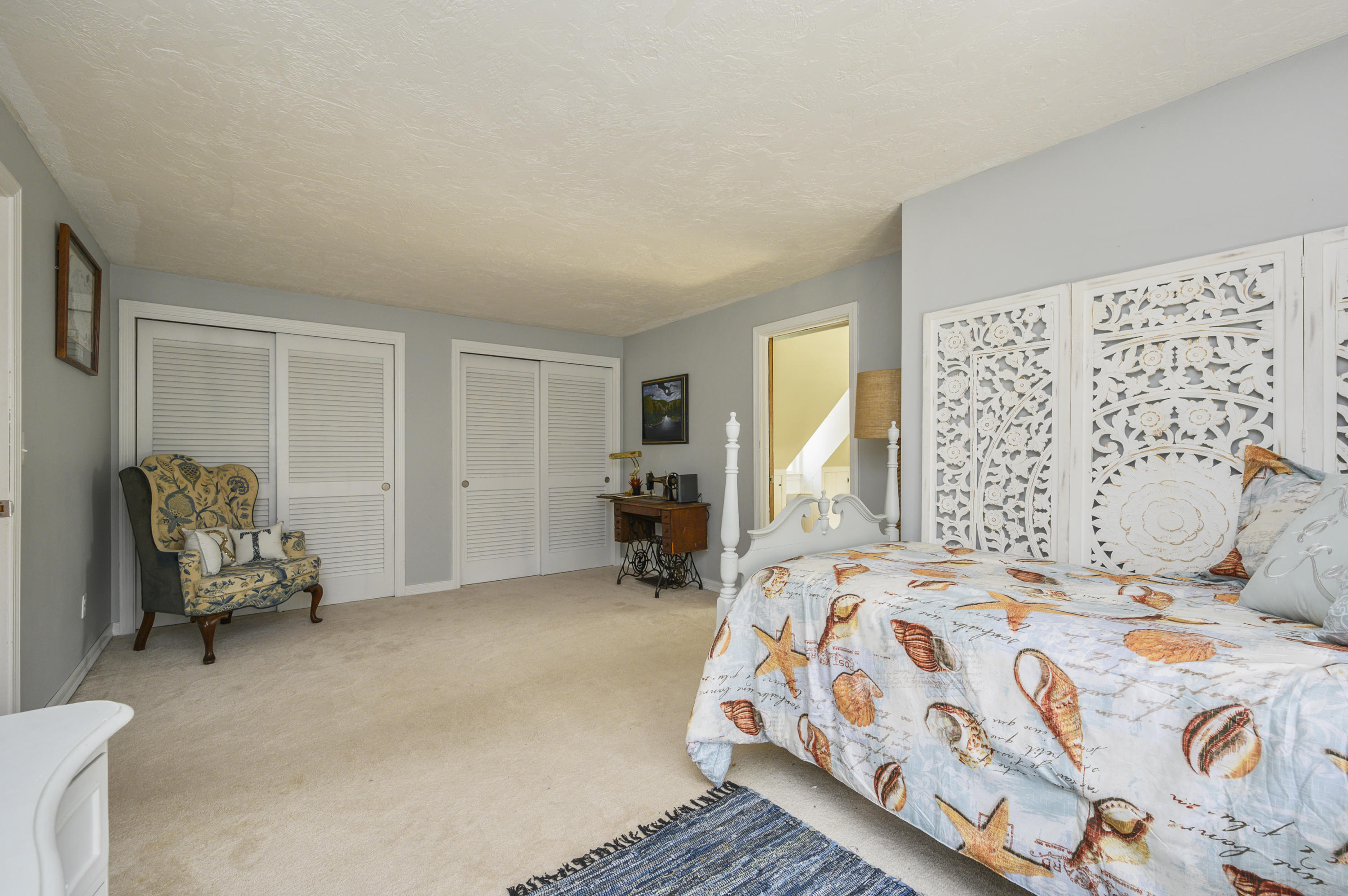 29 Old Kings Road Cotuit, MA 02635 - Photo 23 of 30 a bedroom with a bed and a couch