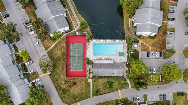 an aerial view of residential houses with outdoor space