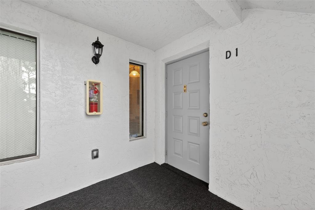 1258 Pine Ridge Circle West, Unit D1 Tarpon Springs, FL 34688 - Photo 6 of 42 a view of an empty room