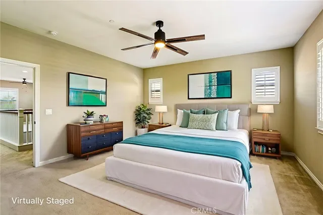 a spacious bedroom with a bed and a couch