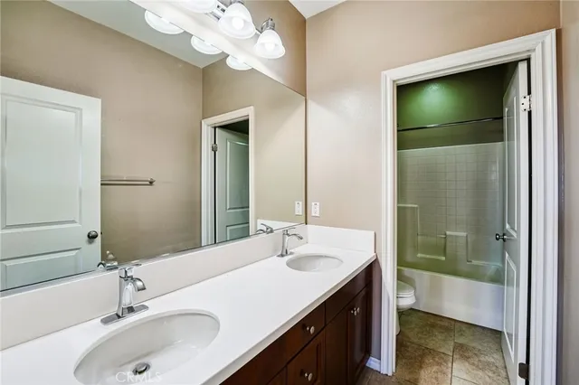 a bathroom with a sink a vanity and a mirror