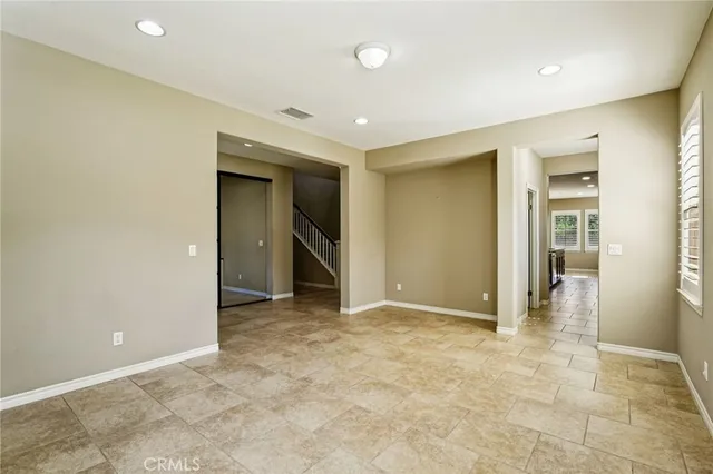 an empty room with closet and a bathroom