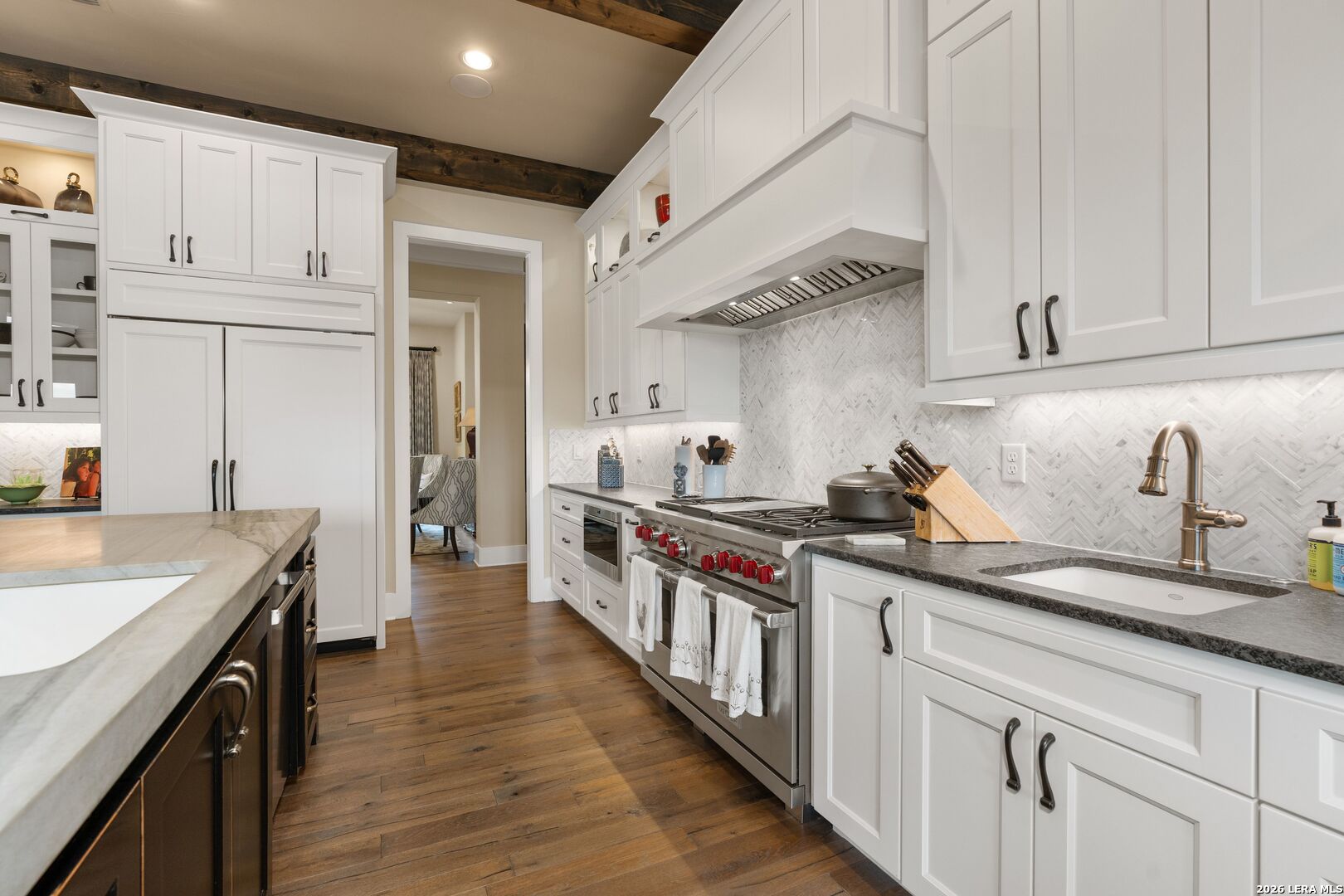 52 Landmark Ridge Bergheim, TX 78004 - Photo 11 of 24 a kitchen with stainless steel appliances granite countertop a sink stove and cabinets