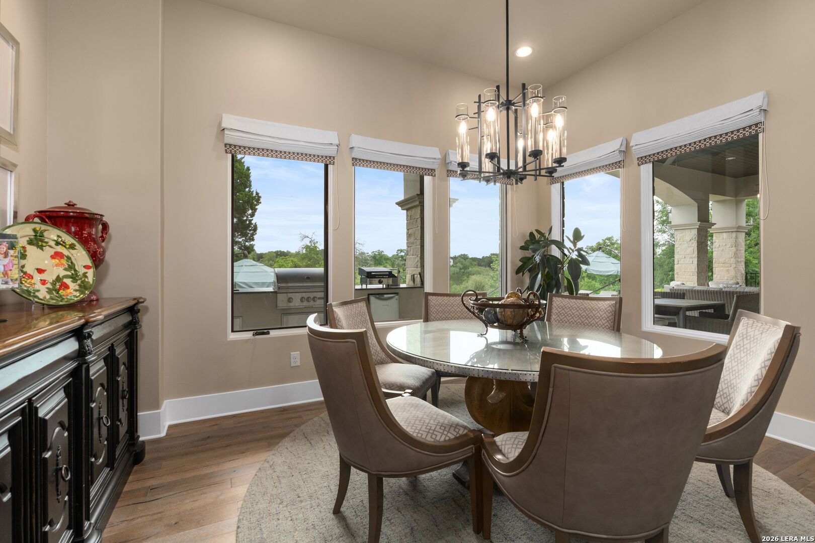 52 Landmark Ridge Bergheim, TX 78004 - Photo 12 of 24 a dining room with furniture a chandelier and wooden floor