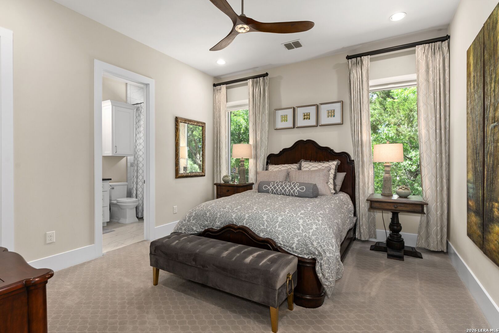 52 Landmark Ridge Bergheim, TX 78004 - Photo 18 of 24 a bedroom with a bed chair and a large window