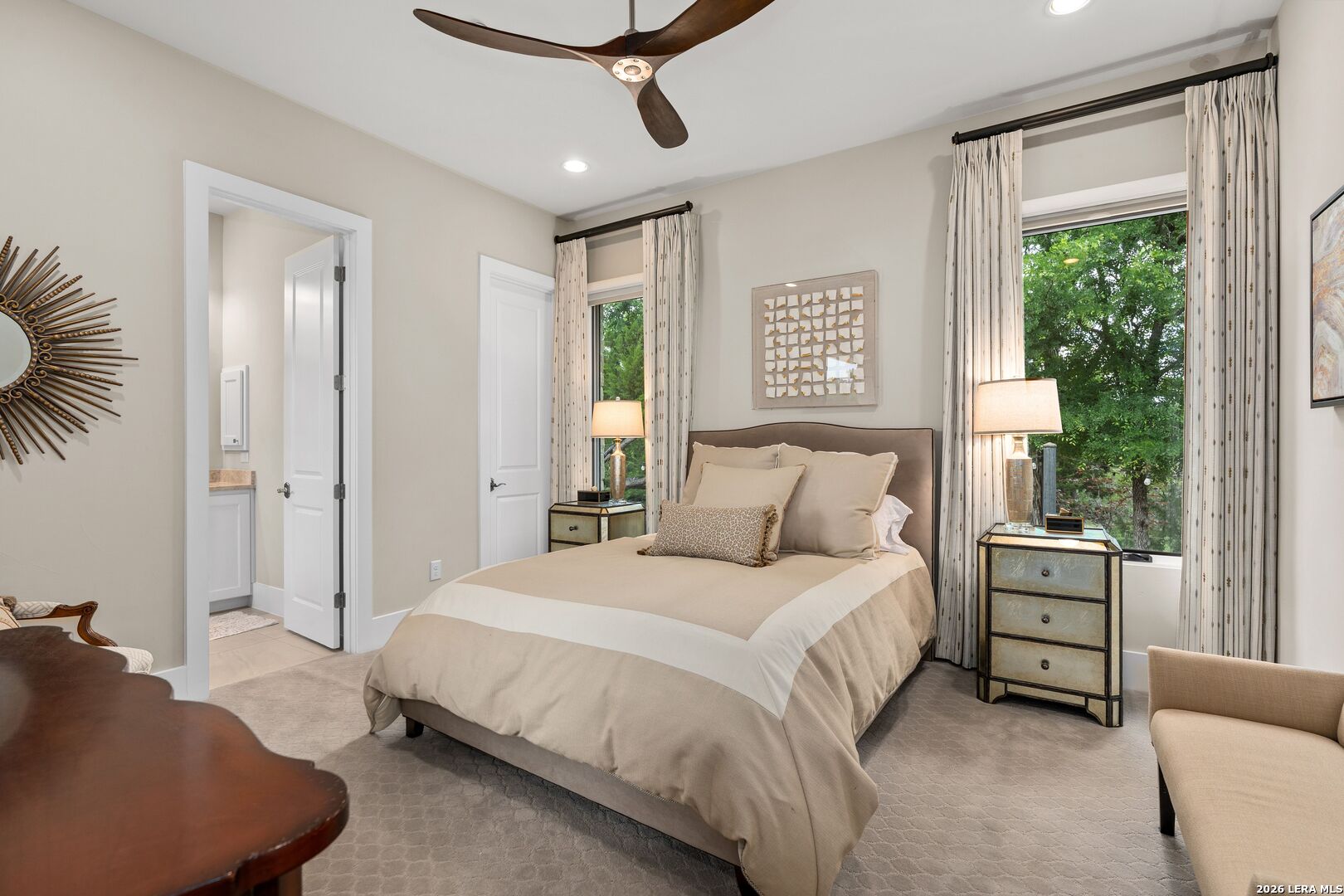 52 Landmark Ridge Bergheim, TX 78004 - Photo 20 of 24 a spacious bedroom with a bed a couch and a window