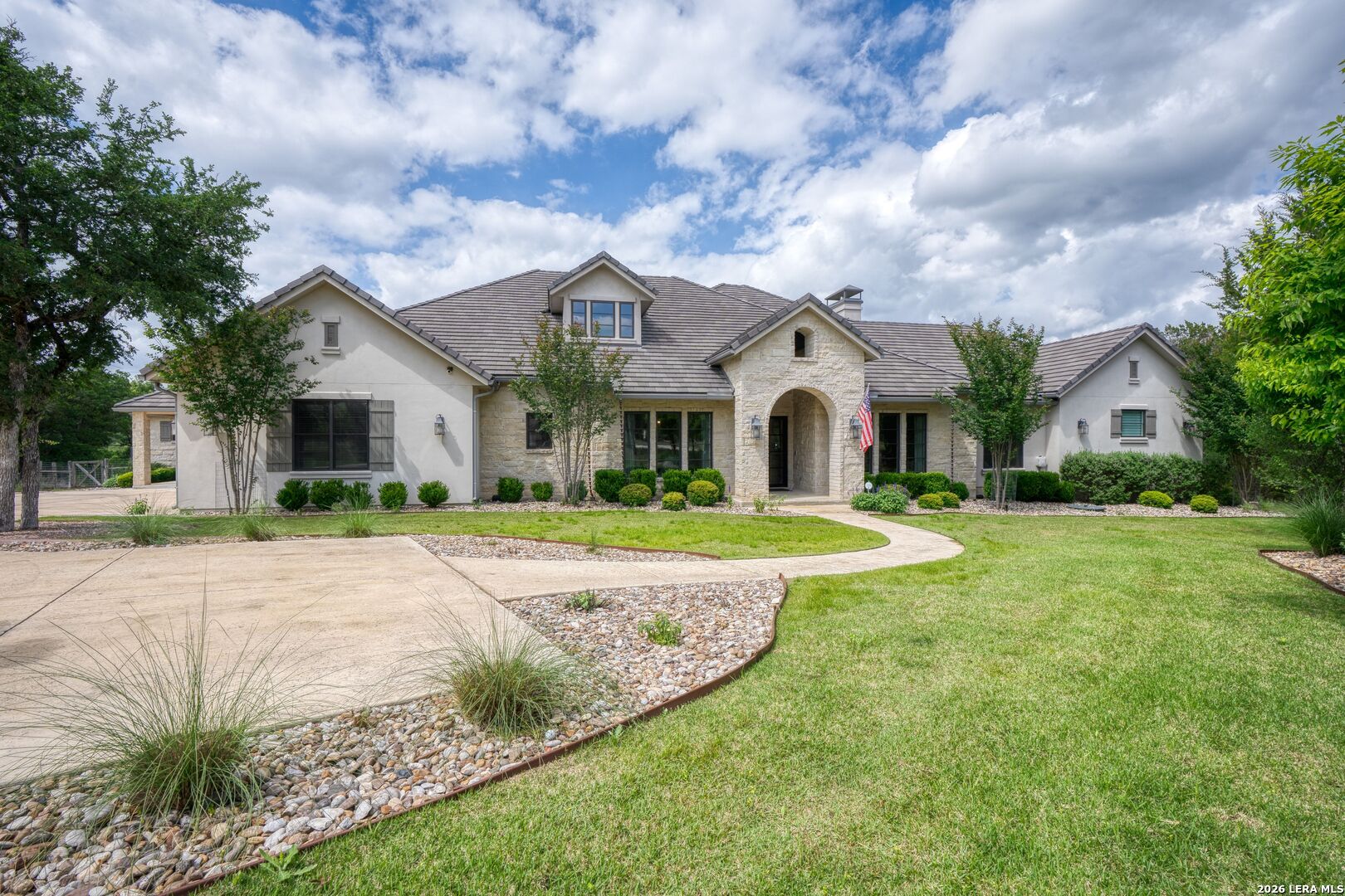 52 Landmark Ridge Bergheim, TX 78004 - Photo 2 of 24 a front view of a house with garden