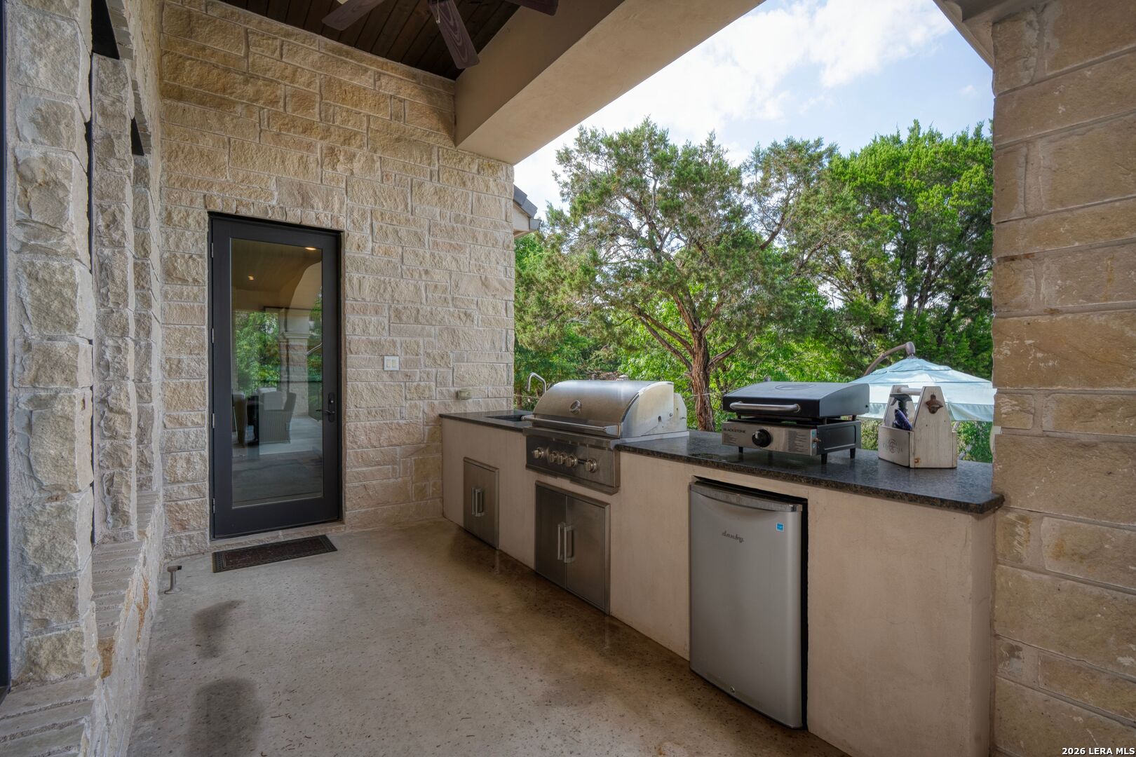 52 Landmark Ridge Bergheim, TX 78004 - Photo 23 of 24 a kitchen with stainless steel appliances a sink and a stove